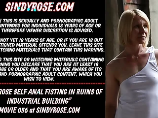 Sindy Rose self anal fisting in the ruins of industral building